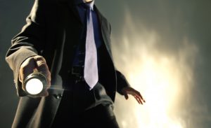man-in-suit-holding-torch-157280021-5990ba490d327a0010376e6f.jpg  